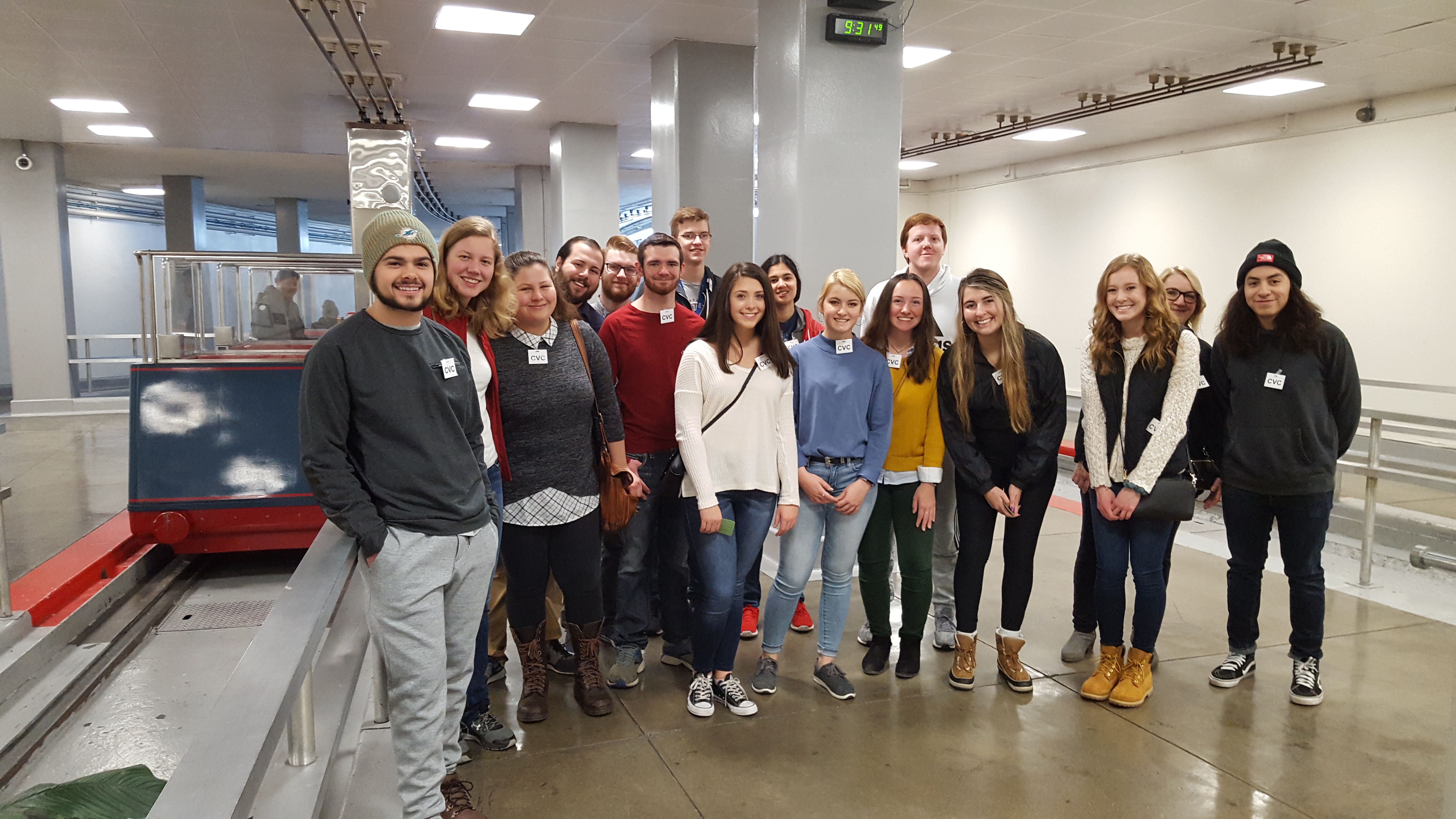 Group of students waiting in a train station