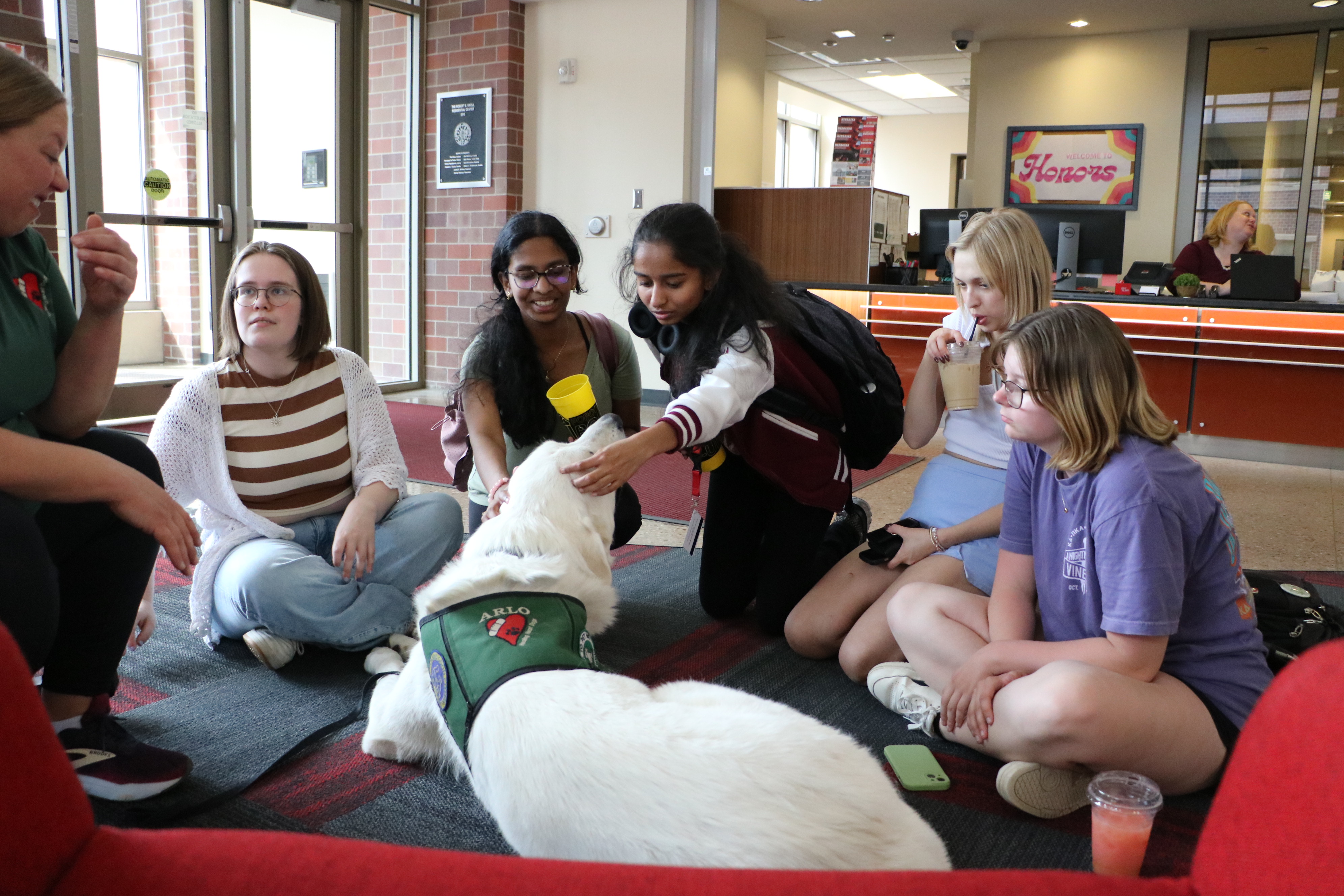 Students petting a dog