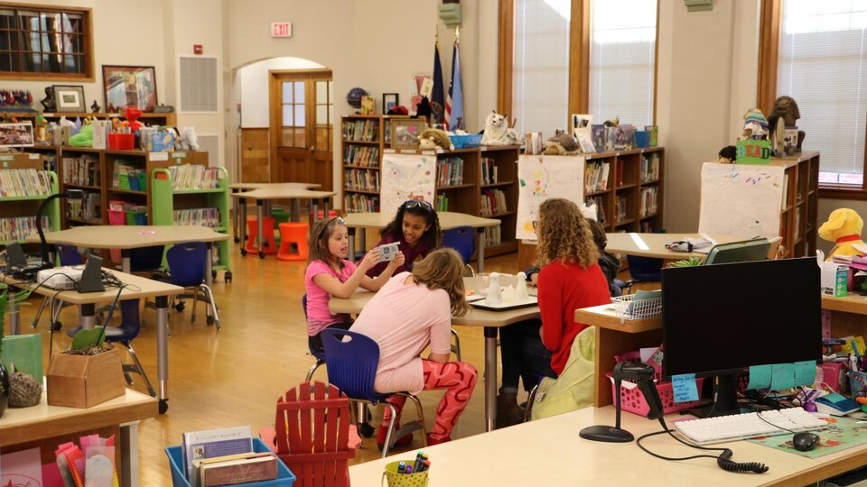 young kids in after school club classroom