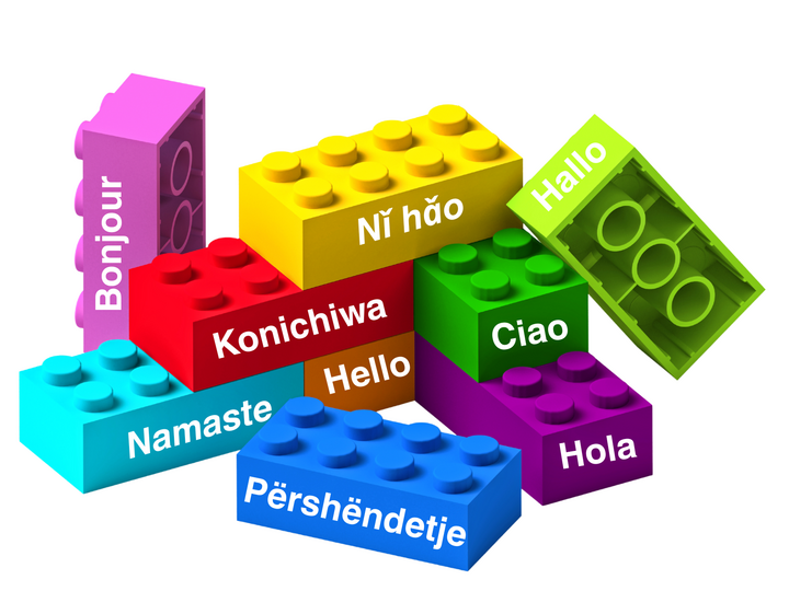 Colorful building blocks with greetings in various languages, including Bonjour, Hola, and Hello.