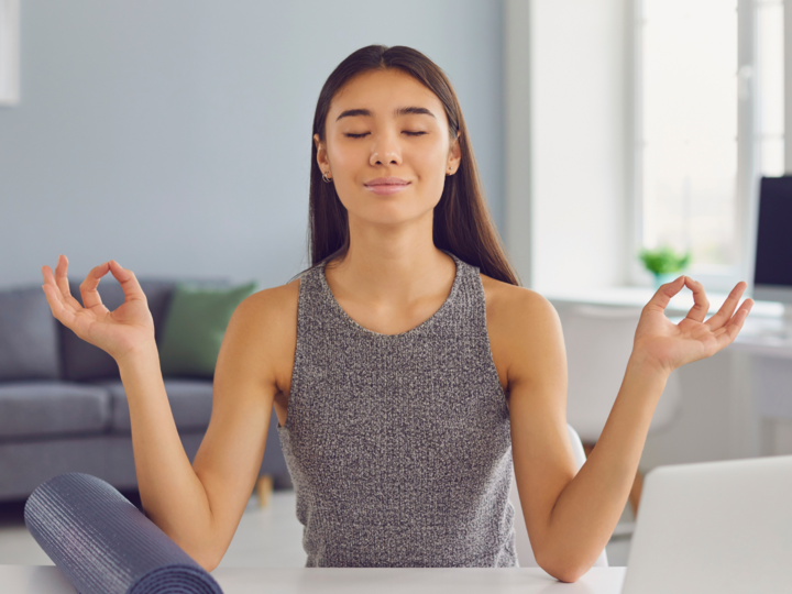 Woman meditating at a desk