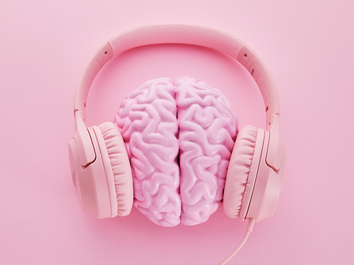 A brain with headphones around it