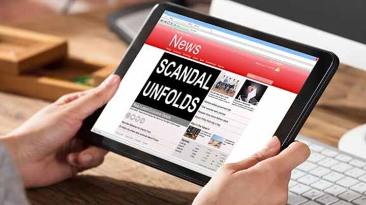 scandal headline on tablet